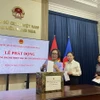 Đại sứ quán Việt Nam tại Liên bang Nga quyên góp ủng hộ đồng bào chịu thiệt hại từ cơn bão số 3. (Ảnh: TTXVN)