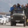 Người tị nạn Armenia rời khỏi Nagorny-Karabakh đi lánh nạn tới các thành phố của Armenia ngày 26/9/2023. (Ảnh: AFP/TTXVN)