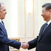 Ngoại trưởng Nga Sergei Lavrov (trái) đã có cuộc gặp với Chủ tịch Trung Quốc Tập Cận Bình ngày 9/4. (Nguồn: Reuters)