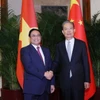 Thủ tướng Phạm Minh Chính hội kiến Ủy viên trưởng Nhân đại Toàn quốc Trung Quốc Triệu Lạc Tế. (Ảnh: Dương Giang/TTXVN)