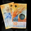 Đồng tiền mệnh giá 10 franc Thụy Sĩ tại Lausanne. (Ảnh: AFP/TTXVN)