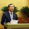 Chủ nhiệm Ủy ban Quốc phòng và An ninh của Quốc hội Lê Tấn Tới trình bày Báo cáo Thẩm tra Dự án Luật Công nghiệp Quốc phòng, An ninh và Động viên Công nghiệp. (Ảnh: An Đăng/TTXVN)