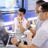 Các đơn vị doanh nghiệp giới thiệu công nghệ thông tin để xây dựng hồ sơ bệnh án điện tử tại bệnh viện. (Ảnh: Công Thử/TTXVN)