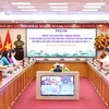Trưởng Ban Tuyên giáo Trung ương Nguyễn Trọng Nghĩa và các đại biểu tại buổi đến thăm, chúc mừng TTXVN nhân Ngày Báo chí cách mạng Việt Nam. (Ảnh: Minh Đức/TTXVN)