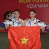 Vận động viên Đặng Thị Hồng Nguyên và Lý Thanh Vân đoạt Huy chương Vàng ở nội dung đối kháng. (Ảnh: Văn Dũng/TTXVN)