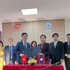 Ngành Văn thư-Lưu trữ Việt Nam và Lào ký kết hợp tác trong năm 2024. (Ảnh: Minh Thu/Vietnam+)
