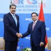 Thủ tướng Phạm Minh Chính gặp Tổng thống Venezuela Nicolas Maduro. (Ảnh: Dương Giang/TTXVN)