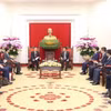 Ông Nguyễn Xuân Thắng, Ủy viên Bộ Chính trị, Chủ tịch Hội đồng Lý luận Trung ương, Giám đốc Học viện Chính trị Quốc gia Hồ Chí Minh tiếp Viện trưởng Viện Nghiên cứu Trung ương về Văn kiện lịch sử Đảng Cộng sản Trung Quốc Khúc Thanh Sơn. (Ảnh: Phương Hoa/TTXVN)