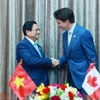 Thủ tướng Phạm Minh Chính gặp Thủ tướng Canada Justin Trudeau. (Ảnh: Dương Giang/TTXVN)