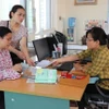 Giải quyết chế độ bảo hiểm xã hội cho người lao động. (Ảnh: PV/Vietnam+)
