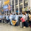 Lao động chuẩn bị xuất cảnh đi làm việc ở nước ngoài. (Ảnh: PV/Vietnam+)