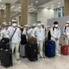 Lao động làm thủ tục sang Hàn Quốc làm việc. (Ảnh: PV/Vietnam+)