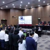 Các bị cáo nghe tòa tuyên án. (Ảnh: Phạm Kiên/TTXVN)