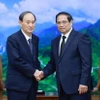 Thủ tướng Phạm Minh Chính tiếp cựu Thủ tướng Nhật Bản Suga Yoshihide sang dự Lễ Quốc tang Tổng Bí thư Nguyễn Phú Trọng. (Ảnh: Dương Giang/TTXVN)