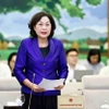Thống đốc Ngân hàng Nhà nước Việt Nam Nguyễn Thị Hồng trình bày tóm tắt tờ trình. (Ảnh: Doãn Tấn/TTXVN)