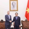 Phó Thủ tướng Trần Lưu Quang tiếp Giám đốc vận hành Tập đoàn LEGO Carsten Rasmussen. (Ảnh: Doãn Tấn/TTXVN)