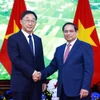 Thủ tướng Phạm Minh Chính tiếp ông Lưu Ninh, Bí thư Đảng ủy Khu tự trị dân tộc Choang Quảng Tây, Trung Quốc. (Ảnh: Dương Giang/TTXVN)