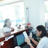 Doanh nghiệp đến thực hiện giao dịch tại Cục Thuế Tây Ninh. (Ảnh minh họa: Minh Phú/TTXVN)