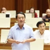 Bộ trưởng, Chủ nhiệm Ủy ban Dân tộc Hầu A Lềnh giải trình làm rõ chất vấn của đại biểu Quốc hội. (Ảnh: Phương Hoa/TTXVN)