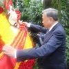 Tổng Bí thư, Chủ tịch nước Tô Lâm dâng hoa tưởng niệm Liệt sỹ Phạm Hồng Thái. (Ảnh: Trí Dũng/TTXVN)