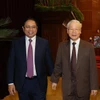 Tổng Bí thư Nguyễn Phú Trọng, Thủ tướng Chính phủ Phạm Minh Chính dự Hội nghị toàn quốc quán triệt và triển khai Nghị quyết 11-NQ/TW ngày 10/2/2022 của Bộ Chính trị. (Ảnh: Trí Dũng/TTXVN)