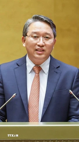 Bộ trưởng Bộ Tư pháp Nguyễn Hải Ninh giải trình, làm rõ một số vấn đề đại biểu Quốc hội nêu. (Ảnh: Doãn Tấn/TTXVN)