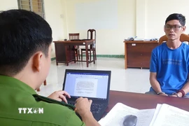 Đối tượng Ngô Hoàng Thăng tại Cơ quan Công an. (Ảnh: TTXVN phát)