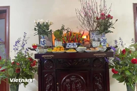Mâm cơm cúng ngày mùng 1 Tết. (Ảnh: Vietnam+)