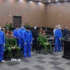 Các bị cáo tại phiên toà xét xử. (Ảnh: Phạm Kiên/TTXVN)