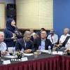 Lãnh đạo doanh nghiệp Malaysia trao đổi tại hội thảo. (Ảnh: Viên Luyến/TTXVN)