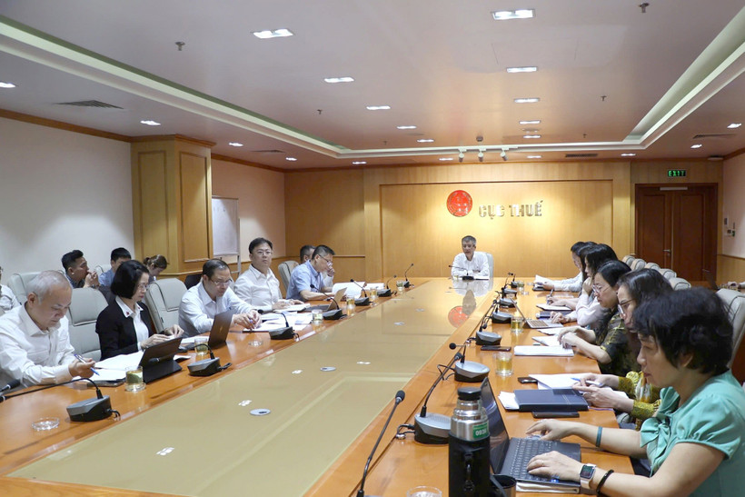 Cuộc họp đánh giá hiệu quả thực hiện Đề án phát triển ứng dụng dữ liệu về dân cư, định danh và xác thực điện tử phục vụ chuyển đổi số quốc gia giai đoạn 2022 - 2025, tầm nhìn đến năm 2030 (Đề án 06) do Cục Thuế tổ chức, ngày 26/3. (Ảnh: CT/Vietnam+)