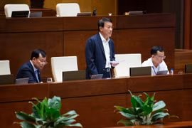 Bộ trưởng Bộ Công an Lương Tam Quang giải trình làm rõ vấn đề Đại biểu Quốc hội nêu tại Kỳ họp thứ 9, Quốc hội khóa XV. (Ảnh: TTXVN)
