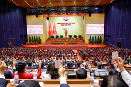 Đại hội biểu quyết thông qua danh sách bầu cử BCH Trung ương Đảng khóa XIV. (Ảnh: TTXVN)