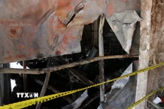 Hiện trường vụ cháy khiến 4 người trong một gia đình tử vong. (Ảnh: Nguyên Dung/ TTXVN)