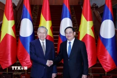 Tổng Bí thư Tô Lâm hội kiến Thủ tướng Chính phủ Lào Sonexay Siphandone. (Ảnh: Thống Nhất/TTXVN)