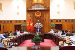 Thủ tướng Phạm Minh Chính chủ trì họp khắc phục hậu quả thiên tai sau bão. (Ảnh: Dương Giang/TTXVN)