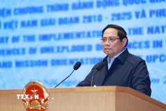 Thủ tướng Phạm Minh Chính phát biểu chỉ đạo Hội nghị tổng kết thực hiện Chương trình hành động quốc gia khắc phục hậu quả bom mìn sau chiến tranh ở Việt Nam. (Ảnh: Dương Giang/TTXVN)