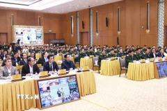 Thủ tướng Phạm Minh Chính dự Hội nghị tổng kết Chương trình hành động quốc gia khắc phục hậu quả bom mìn sau chiến tranh ở Việt Nam. (Ảnh: Dương Giang/TTXVN)