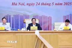Thủ tướng Phạm Minh Chính chủ trì cuộc làm việc về tình hình thị trường vàng. (Ảnh: Dương Giang/TTXVN)