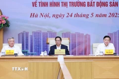Thủ tướng Phạm Minh Chính chủ trì cuộc làm việc của Thường trực Chính phủ về tình hình thị trường bất động sản. (Ảnh: Dương Giang/TTXVN)