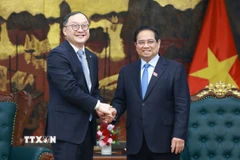 Thủ tướng Phạm Minh Chính tiếp ông Châu Gia Nghĩa, Chủ tịch Khu vực Châu Á-Thái Bình Dương của Tập đoàn Xây dựng Điện lực Trung Quốc. (Ảnh: Dương Giang/TTXVN)