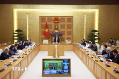 Thủ tướng Phạm Minh Chính chủ trì họp triển khai “Chiến dịch Quang Trung” thần tốc xây dựng nhà ở cho các gia đình bị thiệt hại do thiên tai tại miền Trung. (Ảnh: Dương Giang/TTXVN)