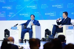 Thủ tướng Phạm Minh Chính tham dự đối thoại với ông Stephan Mergenthaler, Giám đốc điều hành Diễn đàn Kinh tế thế giới (WEF) với chủ đề “Khoa học, công nghệ định hình Việt Nam trong kỷ nguyên vươn mình”. (Ảnh: Dương Giang/TTXVN)