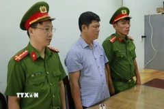 Khởi tố, bắt tạm giam bị can Phạm Đình Nhất. (Ảnh: TTXVN phát)