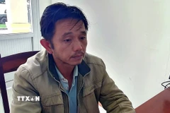 Đối tượng Vương tại cơ quan công an. (Ảnh: CTV/TTXVN phát)