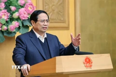 Thủ tướng Phạm Minh Chính chủ trì cuộc họp về xây dựng nhà cho nhân dân bị thiệt hại do bão lũ. (Ảnh: Dương Giang/TTXVN)