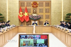 Thủ tướng Phạm Minh Chính chủ trì cuộc họp về xây dựng nhà cho nhân dân bị thiệt hại do bão lũ. (Ảnh: Dương Giang/TTXVN)