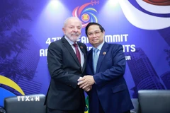 Thủ tướng Phạm Minh Chính gặp Tổng thống Brazil Lula da Silva. (Ảnh: Dương Giang/TTXVN)