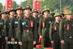 Thanh niên Khánh Hòa thể hiện quyết tâm hoàn thành tốt nhiệm vụ. (Ảnh: Nguyễn Thành/TTXVN)