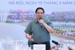Thủ tướng Phạm Minh Chính làm việc với các bộ, ngành, nhà đầu tư và đơn vị thi công dự án Trung tâm Hội chợ Triển lãm Quốc gia. (Ảnh: Dương Giang/TTXVN)